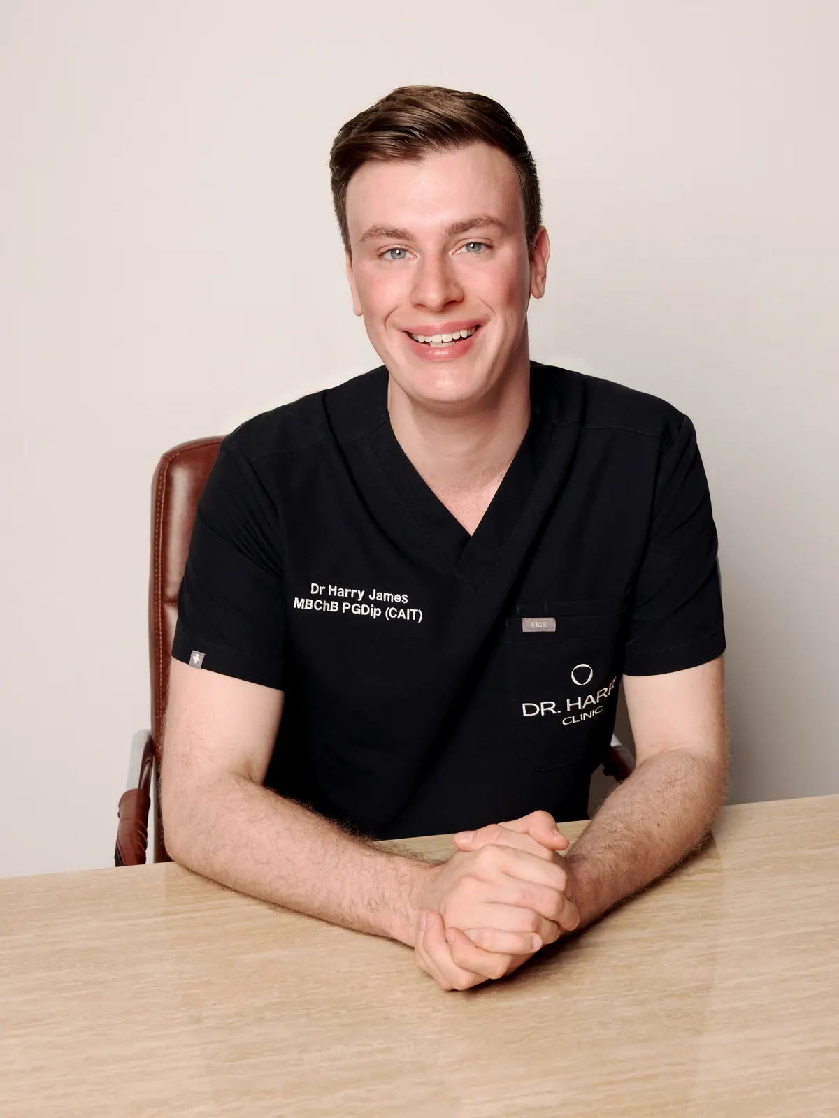 Dr Harry James at the consultation desk